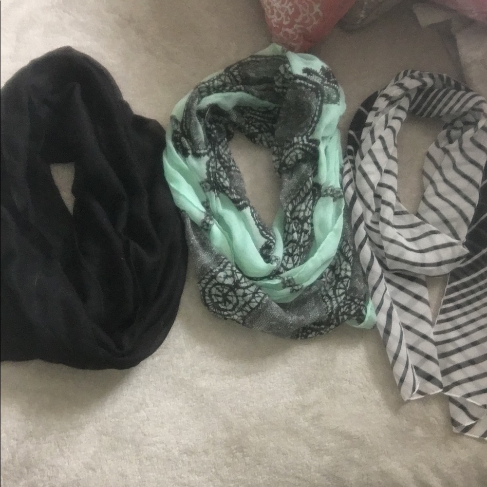 A bundle of three scarfs